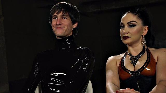 Whipping latex domina pegs sub in suspension bondage