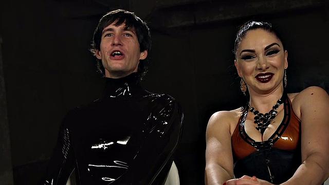 Whipping latex domina pegs sub in suspension bondage