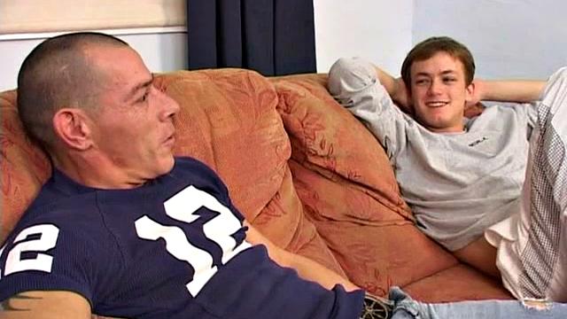 An older man is on the sofa with a cute twink and it isn't long before both are naked, sucking and rimming. With legs in the air, the man slides into his boy toy and they end up fucking all over the sofa.