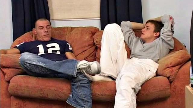 An older man is on the sofa with a cute twink and it isn't long before both are naked, sucking and rimming. With legs in the air, the man slides into his boy toy and they end up fucking all over the sofa.