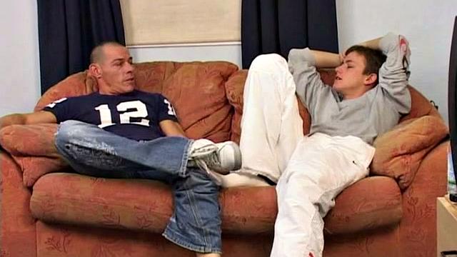 An older man is on the sofa with a cute twink and it isn't long before both are naked, sucking and rimming. With legs in the air, the man slides into his boy toy and they end up fucking all over the sofa.
