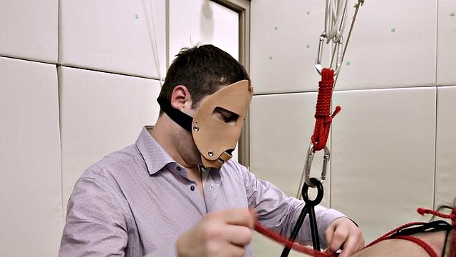 Bound kinky slut sucking on a dick