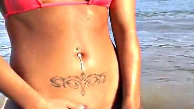 Gorgeous petite teen teases at the beach