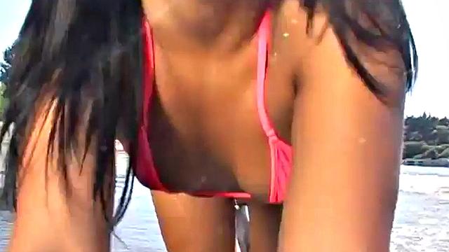 Gorgeous petite teen teases at the beach