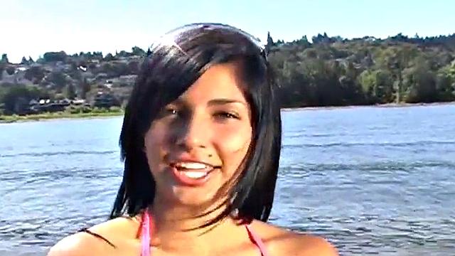 Gorgeous petite teen teases at the beach