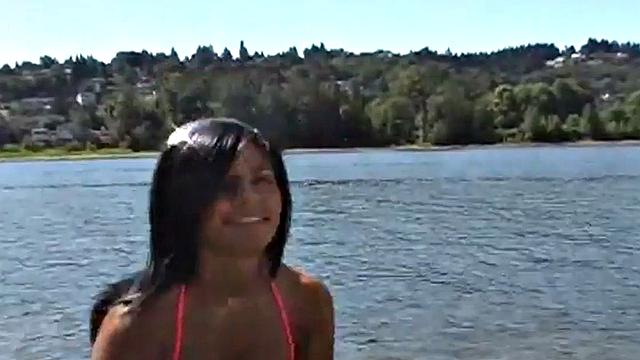 Gorgeous petite teen teases at the beach