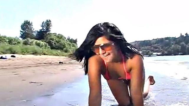 Gorgeous petite teen teases at the beach