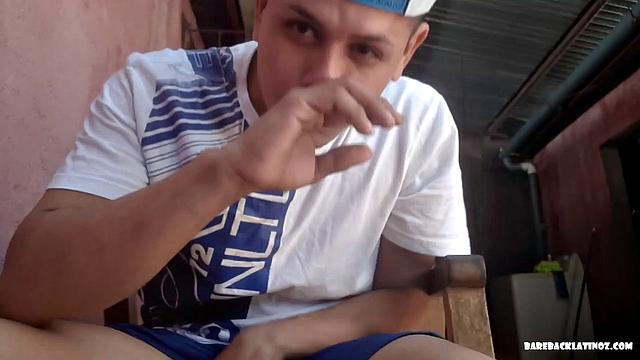 Latin boy Arthur seated in chair, pulling out fat uncut cock from shorts to play with. By the time big dick is hard, young man is naked and ready to beat off.