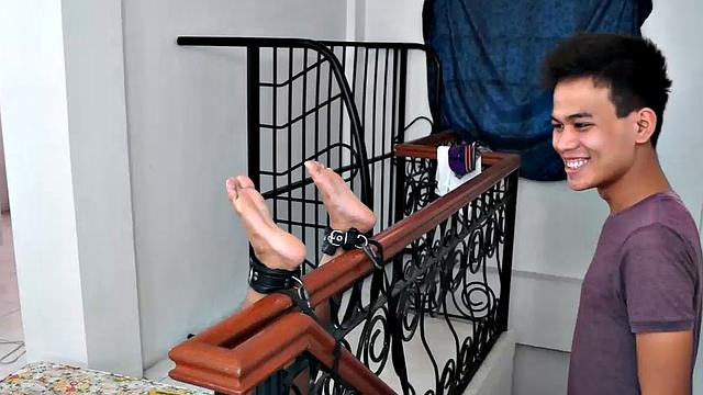Lance returns in this tickling endurance combo. Lance's ankles are bound to the stair banister soles up. Our cutie pie boy tickler Warren tickles his feet. Lance's soles are incredibly smooth and soft like silk.