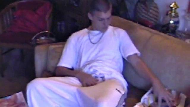 Lance starts out this solo scene sitting on the sofa with his sweats pushed down just below his balls. Lance talks to the camera a little, asking if we like his cock.