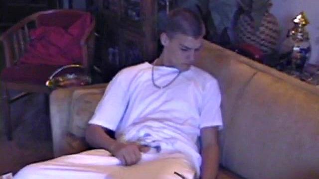 Lance starts out this solo scene sitting on the sofa with his sweats pushed down just below his balls. Lance talks to the camera a little, asking if we like his cock.