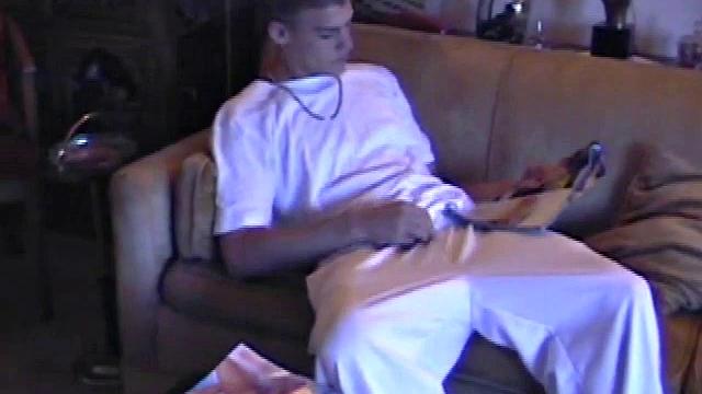 Lance starts out this solo scene sitting on the sofa with his sweats pushed down just below his balls. Lance talks to the camera a little, asking if we like his cock.