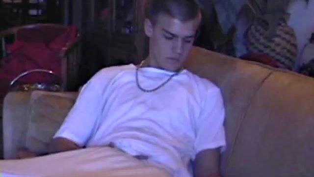 Lance starts out this solo scene sitting on the sofa with his sweats pushed down just below his balls. Lance talks to the camera a little, asking if we like his cock.