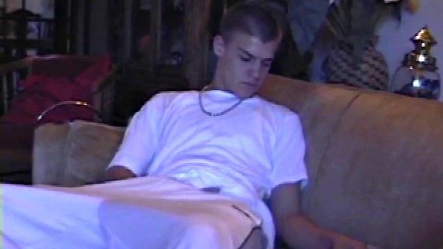 Lance starts out this solo scene sitting on the sofa with his sweats pushed down just below his balls. Lance talks to the camera a little, asking if we like his cock.