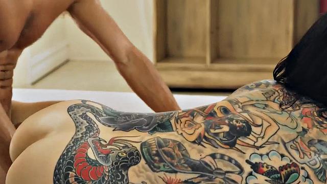 WAM tattooed masseuse deepthroats and rides cock