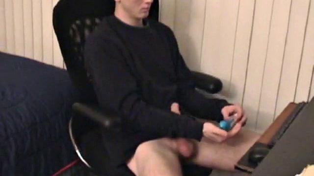 Young Corbin is back and this time, he's at his computer working a growing bulge inside his sweats. When he tugs down the sweats, we see his boner.