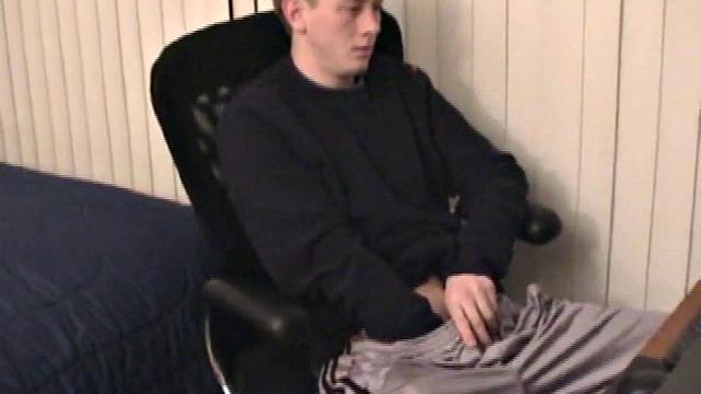 Young Corbin is back and this time, he's at his computer working a growing bulge inside his sweats. When he tugs down the sweats, we see his boner.