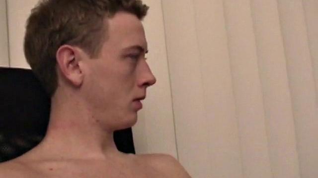 Young Corbin is back and this time, he's at his computer working a growing bulge inside his sweats. When he tugs down the sweats, we see his boner.