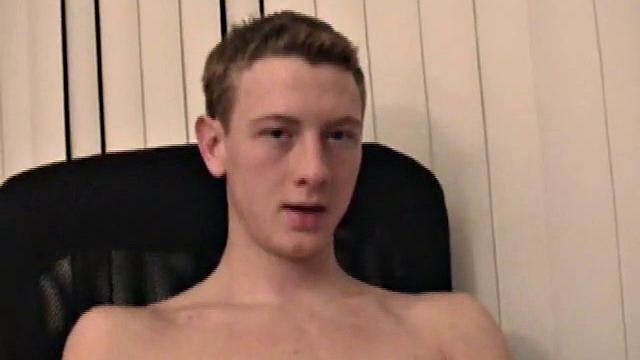 Young Corbin is back and this time, he's at his computer working a growing bulge inside his sweats. When he tugs down the sweats, we see his boner.