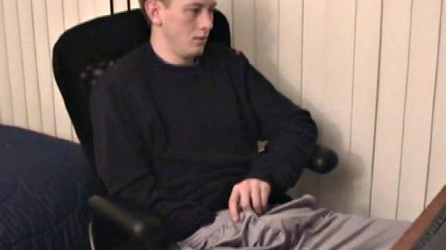 Young Corbin is back and this time, he's at his computer working a growing bulge inside his sweats. When he tugs down the sweats, we see his boner.