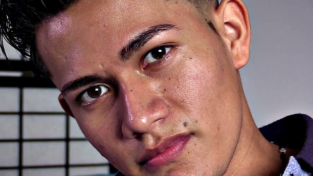 Latin boy Miguel kicks back on his bed, opens his pants and pulls out uncut cock. While watching porn on his phone, the horny young man strokes up a stiff one. Then he strips naked and sits on the edge of his bed, beating off.