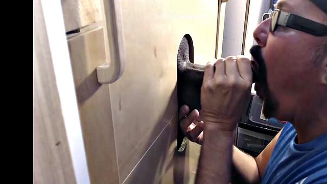 Tattooed gloryhole DILF sucks Black cock with cum