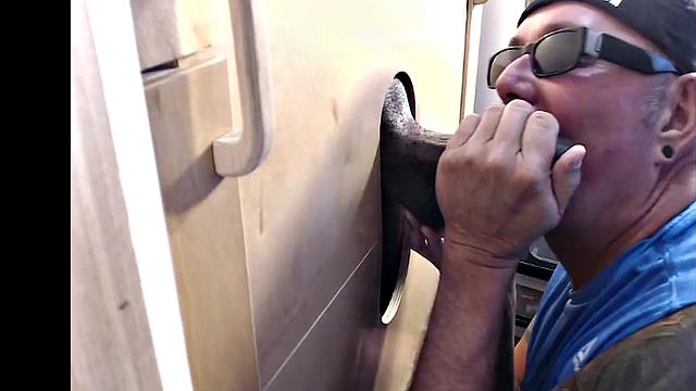 Tattooed gloryhole DILF sucks Black cock with cum