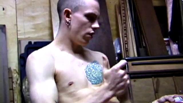 Returning home from work, Shane grabs a porn magazine and heads for the garage. There, he strokes his hard cock, while eating his pre-cum, and then pumps onto his belly.