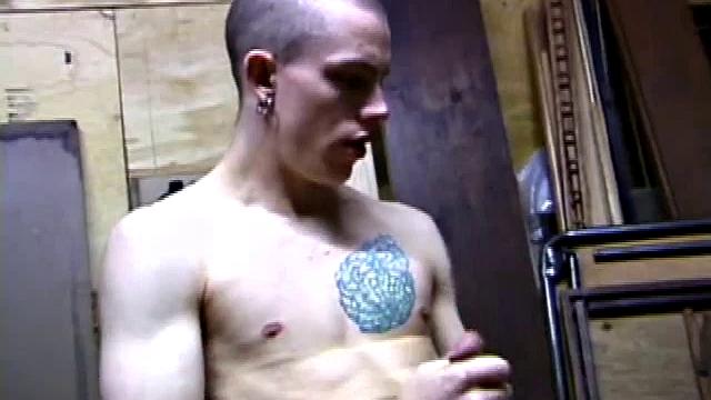 Returning home from work, Shane grabs a porn magazine and heads for the garage. There, he strokes his hard cock, while eating his pre-cum, and then pumps onto his belly.