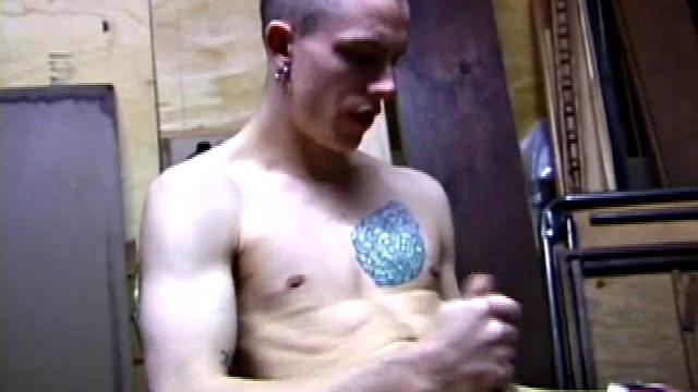 Returning home from work, Shane grabs a porn magazine and heads for the garage. There, he strokes his hard cock, while eating his pre-cum, and then pumps onto his belly.