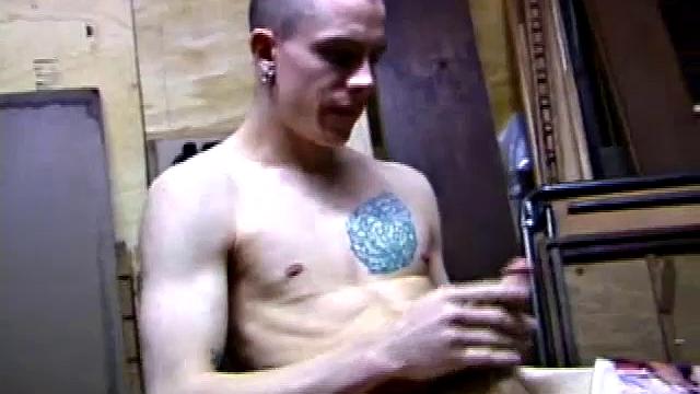 Returning home from work, Shane grabs a porn magazine and heads for the garage. There, he strokes his hard cock, while eating his pre-cum, and then pumps onto his belly.