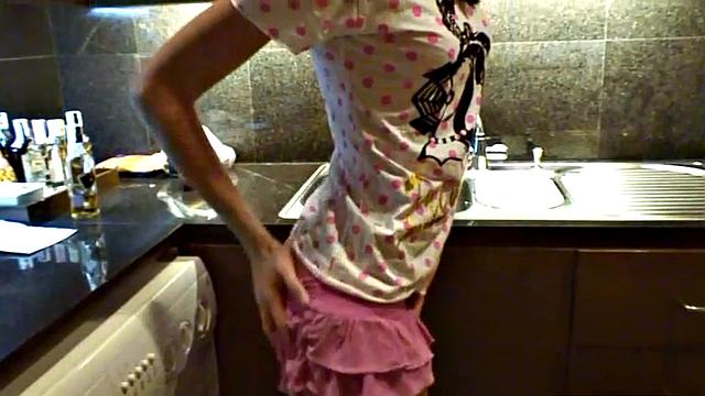 Brunette BrookeSkye rubs her tight bald pussy in the kitchen