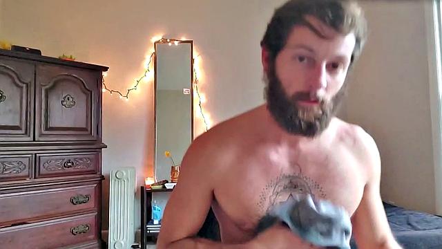 Tattooed otter tugs his dick for cumshot