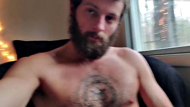 Tattooed otter tugs his dick for cumshot