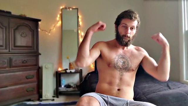 Tattooed otter tugs his dick for cumshot