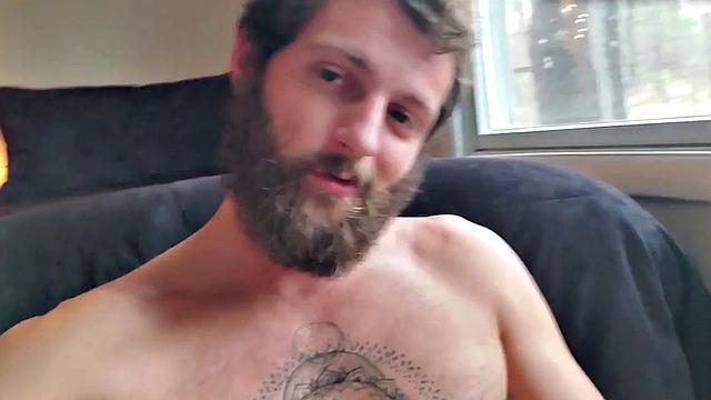 Tattooed otter tugs his dick for cumshot