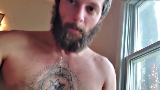 Tattooed otter tugs his dick for cumshot