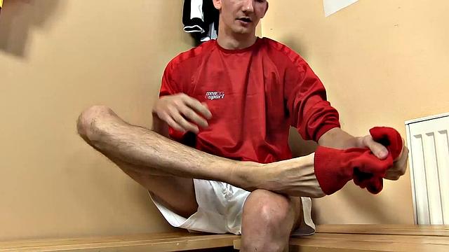 After a game of soccer, Jasper James is in the changing room. He pulls his monster cock out of the leg of his shorts and sniffs his socks, while stroking it against his foot.