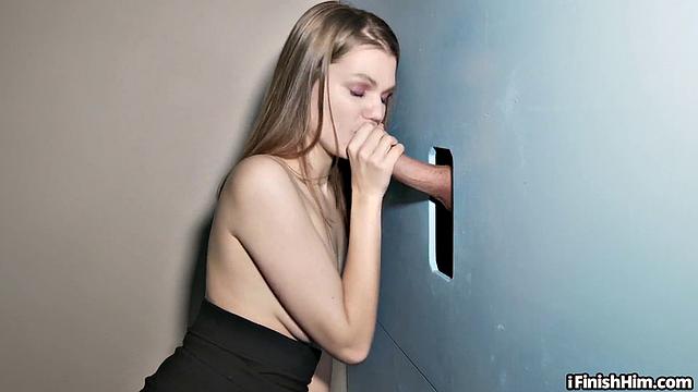 Inked gloryhole lover jerks and sucks through blue wall