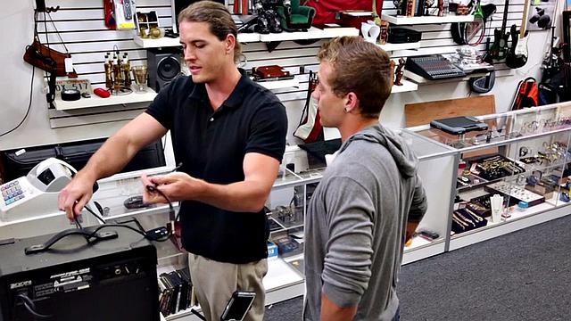 Pawnshop stud gets fucked in latex threesome