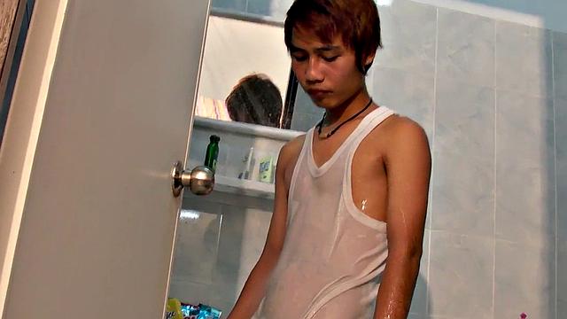 Slim pissing Asian solo twink wanks cock after shower