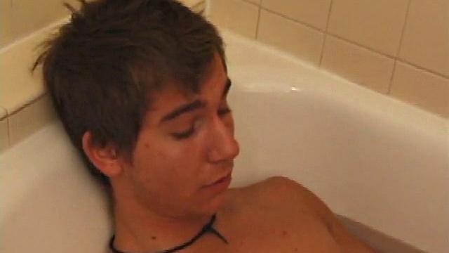 Brock is spending some down time in the bathtub reading a magazine and stroking his cock. After edging himself a few times, it doesn't take long to spew a warm load of cum onto his face.