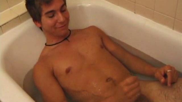 Brock is spending some down time in the bathtub reading a magazine and stroking his cock. After edging himself a few times, it doesn't take long to spew a warm load of cum onto his face.