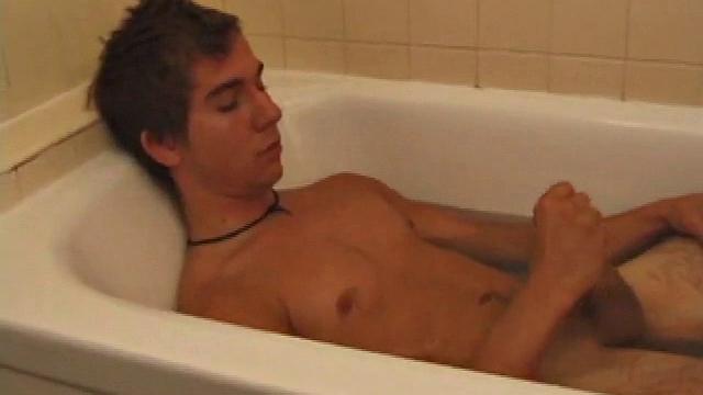 Brock is spending some down time in the bathtub reading a magazine and stroking his cock. After edging himself a few times, it doesn't take long to spew a warm load of cum onto his face.