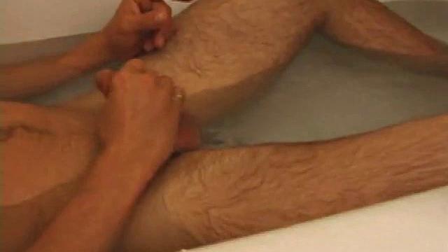 Brock is spending some down time in the bathtub reading a magazine and stroking his cock. After edging himself a few times, it doesn't take long to spew a warm load of cum onto his face.