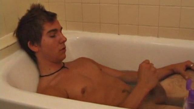 Brock is spending some down time in the bathtub reading a magazine and stroking his cock. After edging himself a few times, it doesn't take long to spew a warm load of cum onto his face.