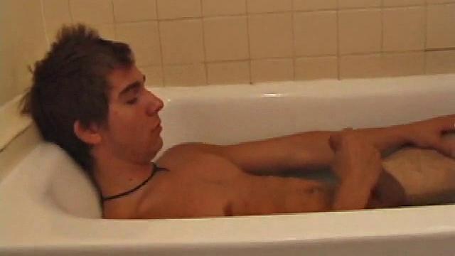 Brock is spending some down time in the bathtub reading a magazine and stroking his cock. After edging himself a few times, it doesn't take long to spew a warm load of cum onto his face.