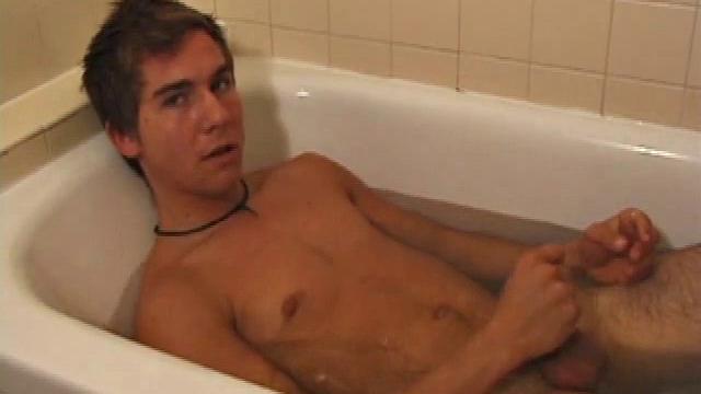 Brock is spending some down time in the bathtub reading a magazine and stroking his cock. After edging himself a few times, it doesn't take long to spew a warm load of cum onto his face.
