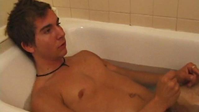 Brock is spending some down time in the bathtub reading a magazine and stroking his cock. After edging himself a few times, it doesn't take long to spew a warm load of cum onto his face.