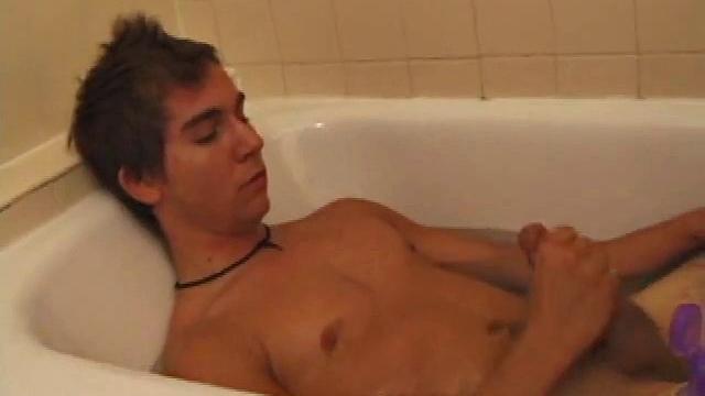 Brock is spending some down time in the bathtub reading a magazine and stroking his cock. After edging himself a few times, it doesn't take long to spew a warm load of cum onto his face.